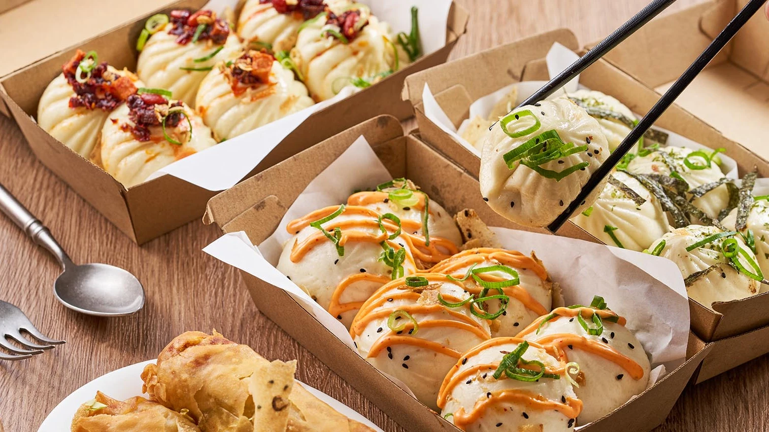 Mrs Bun & Dumpling buns and dumplings served in takeaway trays